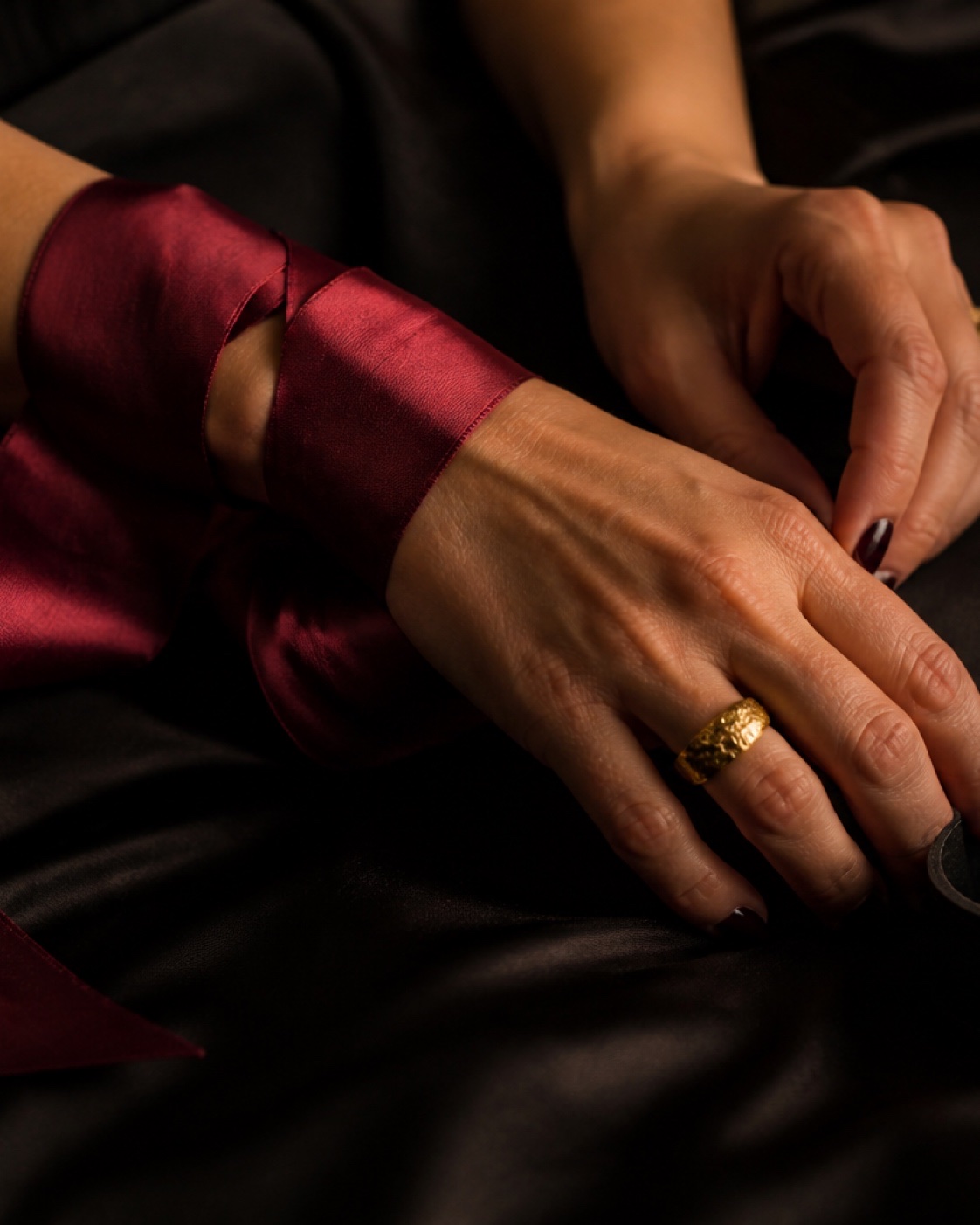 Satin ribbon and leather cuff after-dark campaign
